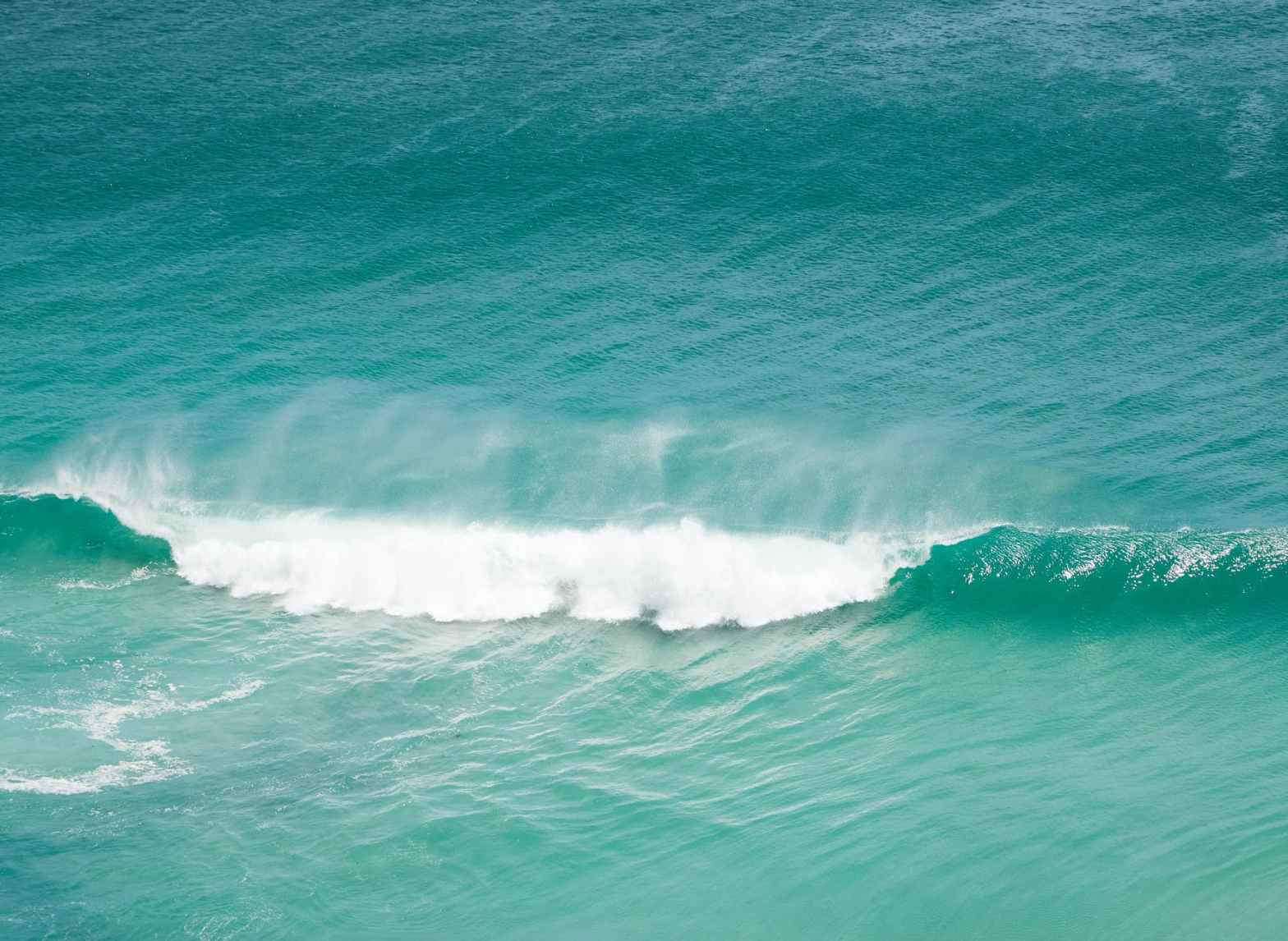 turquoise sea water surface with waves